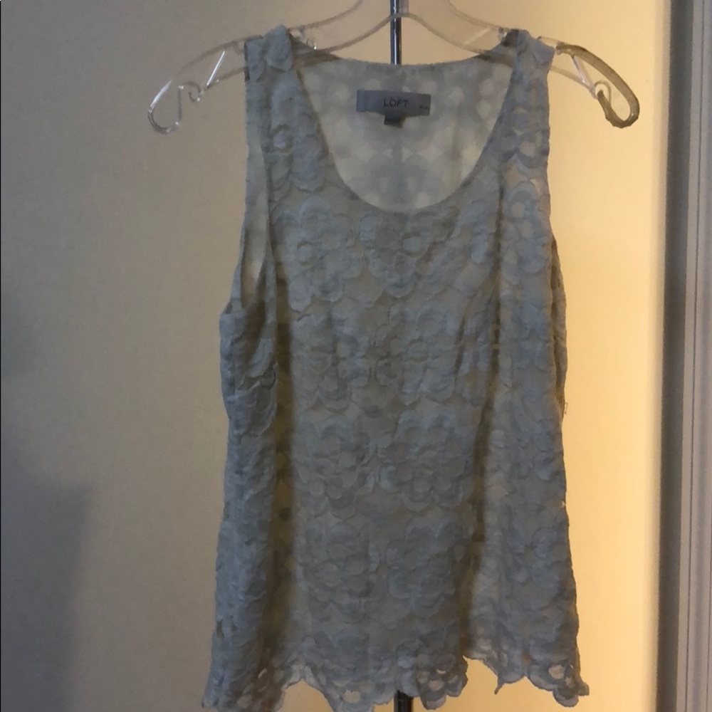 White sleeveless blouse